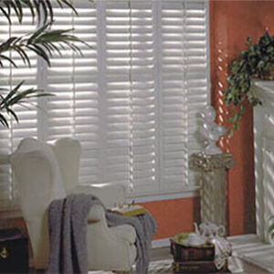 Comfort is key! Create a cozy living room with stylish shutters for perfect light control.